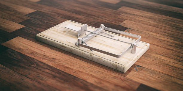 Mouse trap empty on wooden floor background. 3d illustration