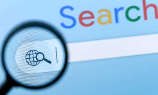 Internet browser search bar with magnifier on computer screen with text Search