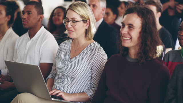 4k video footage of an audience of businesspeople at a conference