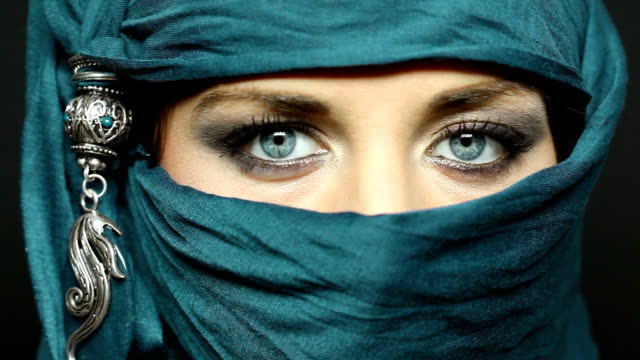 HD1080p: Portrait of an arabic young woman with her beautiful blue eyes in traditional islamic cloth niqab.