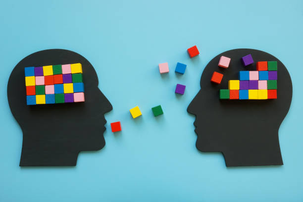 Heads with colorful cubes as a symbol of mentoring and psychotherapy.